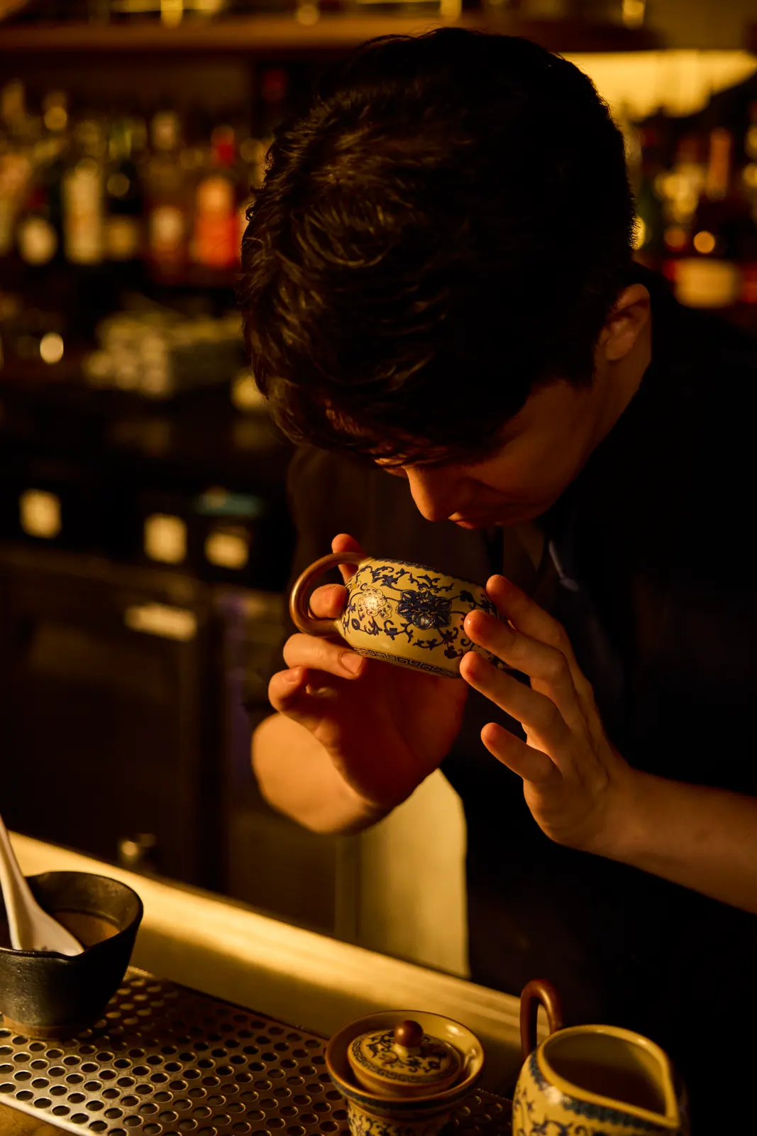 Rewind NYC — Bartender nosing a finished cocktail